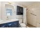 Bathroom featuring a modern vanity, mirror and a tiled walk-in shower at 1515 12Th Se Ct # 55, Largo, FL 33771