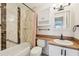 Well-maintained bathroom featuring tile accents, bathtub, and convenient storage at 1515 12Th Se Ct # 55, Largo, FL 33771