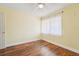 Bedroom featuring hardwood floors, natural light, and a cozy atmosphere at 1515 12Th Se Ct # 55, Largo, FL 33771