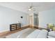 Light bedroom with wood-look floors, ceiling fan, and decor at 1515 12Th Se Ct # 55, Largo, FL 33771