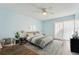 Stylish bedroom with wood-look floors, ceiling fan, and decor at 1515 12Th Se Ct # 55, Largo, FL 33771
