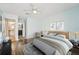 Stylish bedroom with ensuite bathroom, wood-look floors, and decor at 1515 12Th Se Ct # 55, Largo, FL 33771
