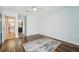 Large bedroom with hardwood floors and natural light, leading into an ensuite bathroom at 1515 12Th Se Ct # 55, Largo, FL 33771