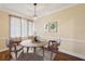 Inviting dining area with hardwood flooring, stylish lighting, and updated trim work at 1515 12Th Se Ct # 55, Largo, FL 33771