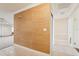 The hallway boasts warm wallpaper design and sleek tile flooring that continues into the main living areas at 1515 12Th Se Ct # 55, Largo, FL 33771