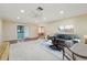 Bright living room featuring a ceiling fan, recessed lighting, and sliding glass door access at 1515 12Th Se Ct # 55, Largo, FL 33771