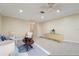 Comfortable living room featuring a ceiling fan, carpeted floors, with view of the hallway and adjacent rooms at 1515 12Th Se Ct # 55, Largo, FL 33771