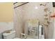 Bathroom needing remodel with walk-in shower, grab bars, and toilet at 1671 Cape Ann Ne Ave # 4, St Petersburg, FL 33702