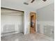 This is a bedroom featuring a closet and a doorway leading to another room at 1671 Cape Ann Ne Ave # 4, St Petersburg, FL 33702