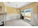 Dining room needing remodeling features tile floors and sliding glass door to patio at 1671 Cape Ann Ne Ave # 4, St Petersburg, FL 33702