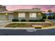Cozy home with a one-car garage, well-maintained landscaping, and a welcoming facade under a vibrant sky at 1671 Cape Ann Ne Ave # 4, St Petersburg, FL 33702