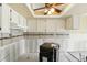 Bright kitchen with white cabinets, tile backsplash and unique ceiling, ready to remodel at 1671 Cape Ann Ne Ave # 4, St Petersburg, FL 33702