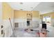 Interior renovation: Room with yellow walls, tile flooring, showing updates in progress with attached rooms at 1671 Cape Ann Ne Ave # 4, St Petersburg, FL 33702