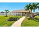 The community pool area features lush landscaping and a building at 1671 Cape Ann Ne Ave # 4, St Petersburg, FL 33702