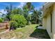 Lush backyard featuring mature trees and some grass at 18426 Sterling Silver Cir, Lutz, FL 33549