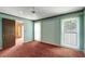 Bedroom with blue walls and white window blinds at 18426 Sterling Silver Cir, Lutz, FL 33549