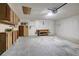 Spacious garage featuring ample storage cabinets, workbench, and a clean concrete floor at 18426 Sterling Silver Cir, Lutz, FL 33549