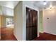 Hallway with closet, and views into the living room and kitchen at 18426 Sterling Silver Cir, Lutz, FL 33549