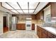 Full kitchen with stainless steel appliances, ample cabinetry, and tile flooring at 18426 Sterling Silver Cir, Lutz, FL 33549