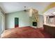 Spacious living room featuring a stone fireplace, neutral walls and sliding doors at 18426 Sterling Silver Cir, Lutz, FL 33549