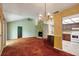 View of living room with fireplace and a view of the kitchen and breakfast bar at 18426 Sterling Silver Cir, Lutz, FL 33549