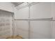 Walk-in Closet with hanging racks, shelves and shoe organizers at 18426 Sterling Silver Cir, Lutz, FL 33549