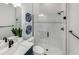 Modern bathroom featuring a sleek vanity, glass shower, and subway tile at 1845 Ridgemore St, North Port, FL 34289