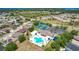 Community amenities including pool, tennis courts, clubhouse, parking, and landscaping at 2321 Wood Pointe Dr, Holiday, FL 34691