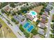 Aerial view of the neighborhood amenities, including pool, tennis courts, and parking at 2321 Wood Pointe Dr, Holiday, FL 34691