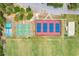 Aerial view showing tennis, basketball, and pickleball courts as well as athletic fields at 2321 Wood Pointe Dr, Holiday, FL 34691