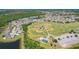 A residential area is showcased from above near a sprawling baseball field, perfect for active living and community engagement at 2321 Wood Pointe Dr, Holiday, FL 34691