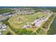 Birds-eye view of a neighborhood near a vast baseball field, offering recreational opportunities and a sense of community at 2321 Wood Pointe Dr, Holiday, FL 34691