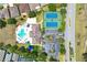Overhead view of community pool, tennis courts, parking, and recreation facilities at 2321 Wood Pointe Dr, Holiday, FL 34691