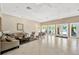 Spacious common area featuring neutral paint, ceiling fans and access to community pool at 2321 Wood Pointe Dr, Holiday, FL 34691