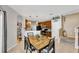 Eat in kitchen and dining area with dark wood cabinets and stairs to the upper level at 2321 Wood Pointe Dr, Holiday, FL 34691