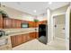 Kitchen featuring granite countertops, stainless steel appliances, and ample cabinet space at 2321 Wood Pointe Dr, Holiday, FL 34691