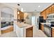 Kitchen with tile flooring, stylish lighting, tile backsplash, and stainless steel appliances at 2321 Wood Pointe Dr, Holiday, FL 34691