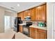 Bright, well-maintained kitchen with stainless steel appliances, ceramic tile backsplash, and plenty of storage at 2321 Wood Pointe Dr, Holiday, FL 34691