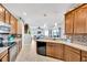 Bright kitchen features stainless steel appliances and a view of the open-concept living space at 2321 Wood Pointe Dr, Holiday, FL 34691