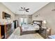 This main bedroom boasts neutral walls, an decorative ceiling fan, and two beautiful matching dark-wood dressers at 2321 Wood Pointe Dr, Holiday, FL 34691