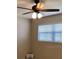 Cozy bedroom featuring a ceiling fan and a bright window view at 2450 Canadian Way # 6, Clearwater, FL 33763