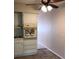 Bright kitchen area featuring ample cabinet storage and overhead lighting at 2450 Canadian Way # 6, Clearwater, FL 33763