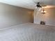 Bright living room with neutral carpet, a chandelier, and ample natural light at 2450 Canadian Way # 6, Clearwater, FL 33763