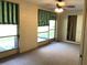 Enclosed patio with lots of windows and a ceiling fan at 2450 Canadian Way # 6, Clearwater, FL 33763