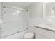 Clean bathroom features shower-tub combo, white tile, granite vanity, and updated fixtures at 2457 Ecuadorian Way # 63, Clearwater, FL 33763