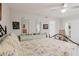 Well-lit bedroom boasts a large ceiling fan, whitewashed floors and dual mirrors above a dresser at 2457 Ecuadorian Way # 63, Clearwater, FL 33763