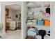 Organized closet with shelving, linen and bedroom view at 2457 Ecuadorian Way # 63, Clearwater, FL 33763