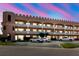 Unique three-story condo complex showcases castle-like design, white balconies, and ample parking at 2457 Ecuadorian Way # 63, Clearwater, FL 33763