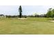 Scenic golf course view showcasing manicured green and a sand bunker, perfect for golf enthusiasts at 2457 Ecuadorian Way # 63, Clearwater, FL 33763