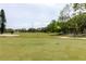 Well-maintained golf course showcasing green fairways and mature trees at 2457 Ecuadorian Way # 63, Clearwater, FL 33763